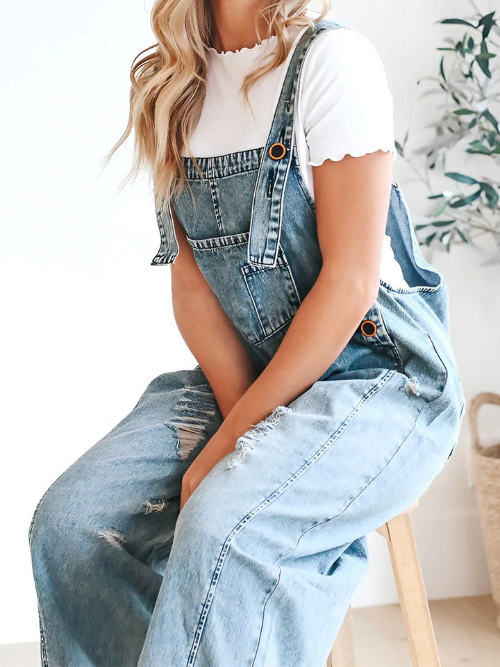CALI - RELAXED DISTRESSED DENIM JUMPSUIT
