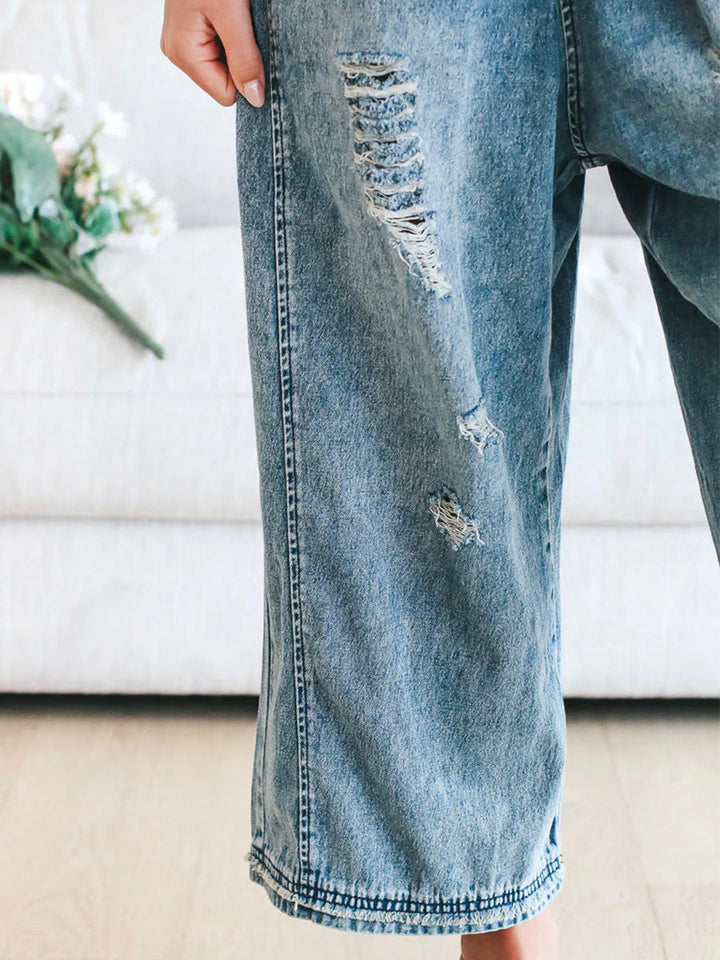CALI - RELAXED DISTRESSED DENIM JUMPSUIT